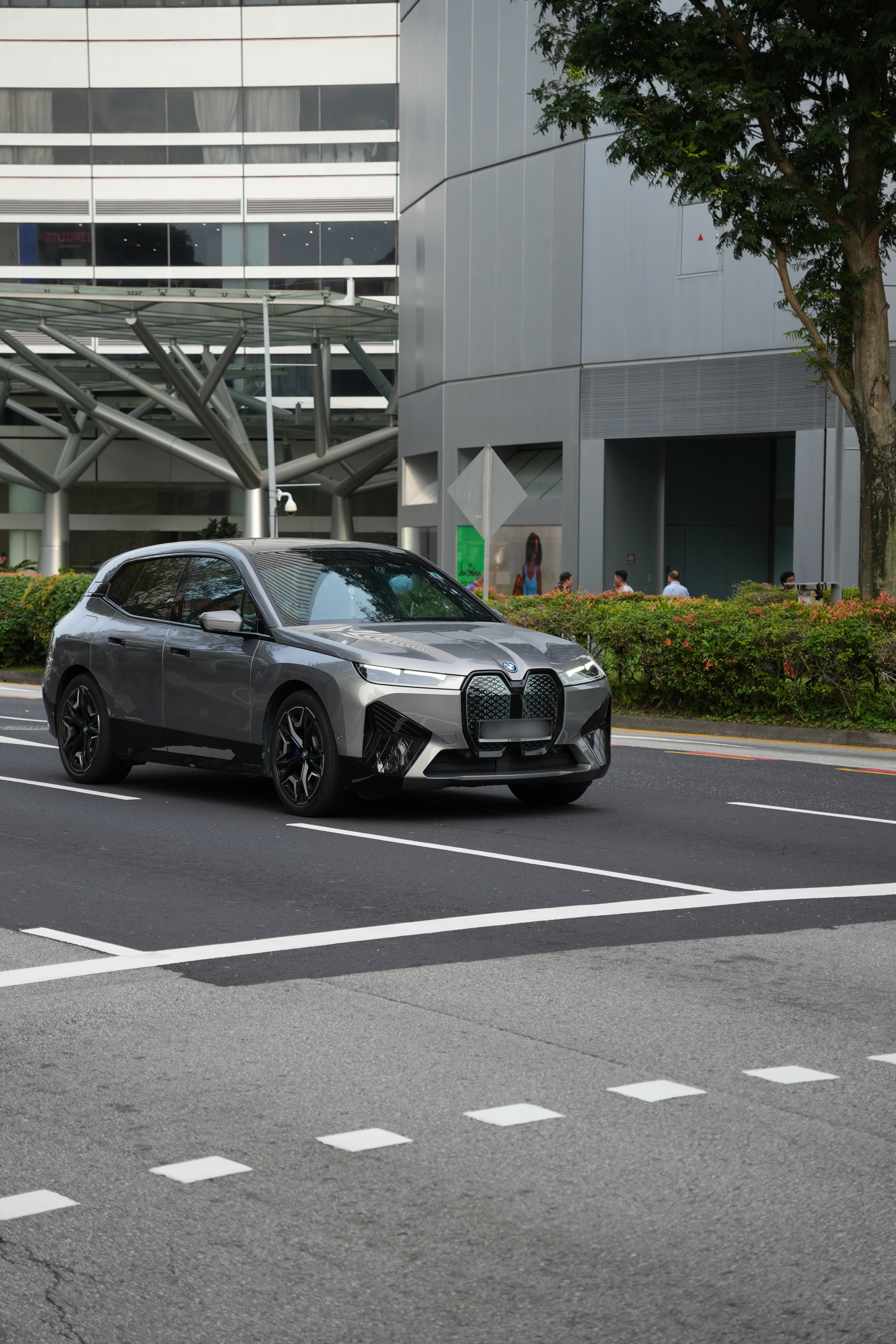 Grey BMW on the street at City Hall MRT in Singapore