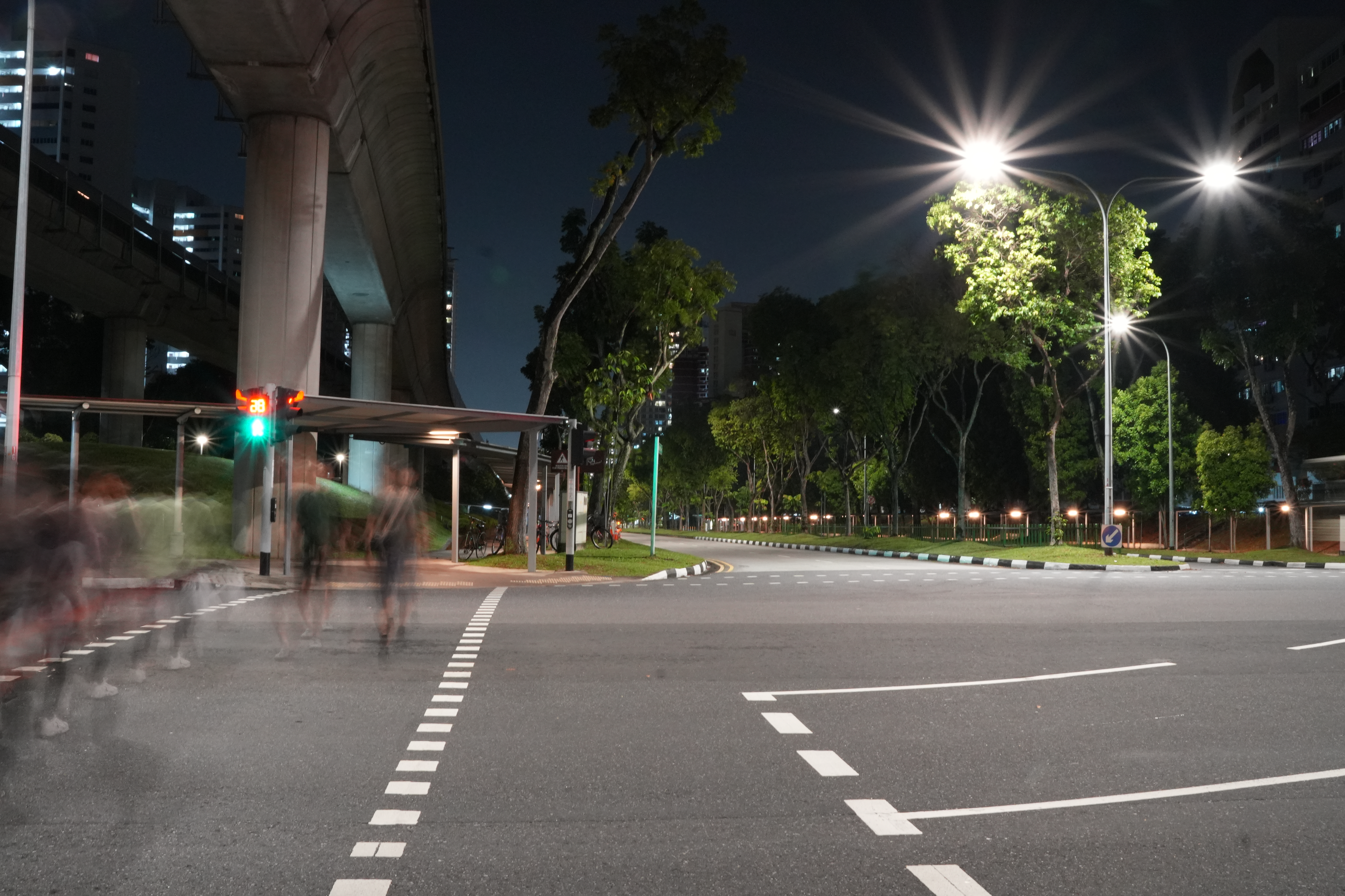 Long exposure image of people crossing the street